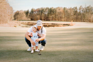 Family Photographer, dad and son on golf course