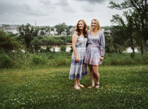 Family Photographer, sisters standing by river