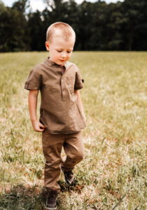 Family Photographer, boy walking in green grass