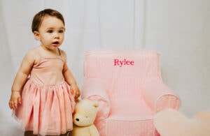 Family Photographer, child in pink dress with teddy bear