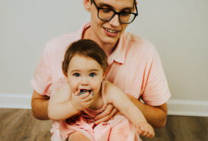 Family Photographer, dad and child in pink dress