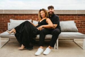 Couples photographer, man and woman sitting on couch